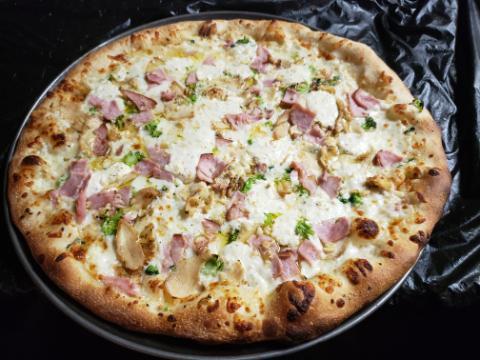Chicken Divine Pizza Combo · White pizza with canadian bacon, broccoli, and chicken.