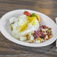 Corned Beef Hash and Eggs · Salt cured beef, potatoes, and onions.
