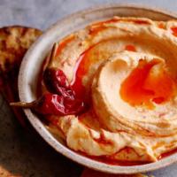Spicy Hummus · A Levantine Dip of Chick Pea paste blended with Crushed Garlic, Tahini, Lemon, Hot Spices an...