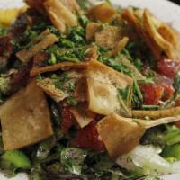 Fattoush Salad · A Vibrant Mediterranean salad made of mixed, Fresh Veggies and crisp Pita Chips; a tangy Lem...