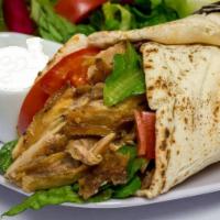 Chicken Shawarma Wrap · Tender Marinated Chicken Breast topped with garlic sauce, topped with Lettuce, Tomatoes and ...