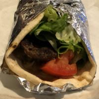 Kofta Kabob Pita Wrap · Ground Lamb and Beef combined with finely chopped Parsley, Onions and Spices topped with Let...