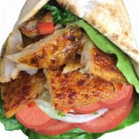 Fish Shawarma Wrap · Spicy Grilled Tilapia Fillet topped with Lettuce, Tomatoes Pickles and Garlic sauce and wrap...