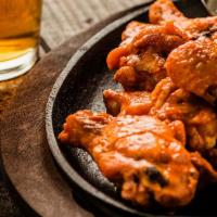 Chicken Wings · Choice of signature buffalo, sweet smoky glaze, chipotle honey BBQ or cajun rub. 