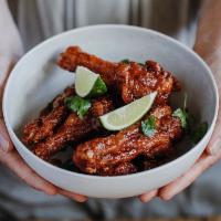 Duck Wings · Six duck wings, sweet smoky glaze, hatch chili ranch, cilantro, lime.