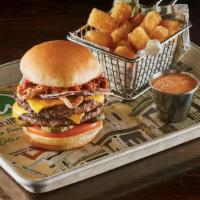 The Ring Leader Burger · Two 1/4 lb. burger patties topped with housemade chili, crispy fried onion rings, government...