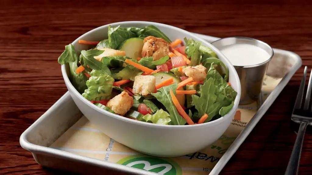 Side Salad · Fresh romaine, housemade croutons, cucumbers, carrots, and tomatoes served with dressing of choice.  130-320 calories.