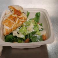 Chicken Caesar Salad · Sliced breast, romaine hearts, Parmesan and kitchen croutons.