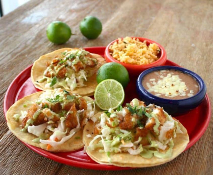 Baja Fish Tacos · Fried cod with jalapeno coleslaw, cilantro-lime crema, onions and cilantro.
