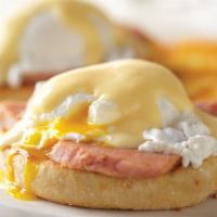Eggs Benedict* · Two poached eggs and smoked ham over a toasted English muffin, topped with Hollandaise sauce...