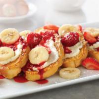 Strawberry-Banana Supreme French Toast · Four slices of vanilla-battered French toast topped with sweet supreme cream, fresh strawber...