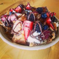 Strawberry Cheesecake Nutella Nachos · House made wonton chips, tossed in cinnamon sugar and topped with cheesecake filling, strawb...