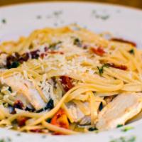 Linguine with Chicken and Sun-dried Tomatoes · Grilled chicken sauteed in a garlic, lemon butter sauce with fresh basil and sun dried tomat...