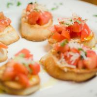 Brenda's Bruschetta · Diced tomatoes, garlic, basil and olive oil on homemade toast points.