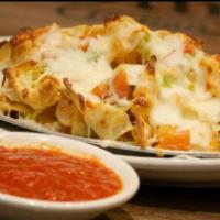 Scott's Italian Nachos Supreme · Homemade pasta chips, green peppers, tomatoes, onions, pepperoncini and cheese.