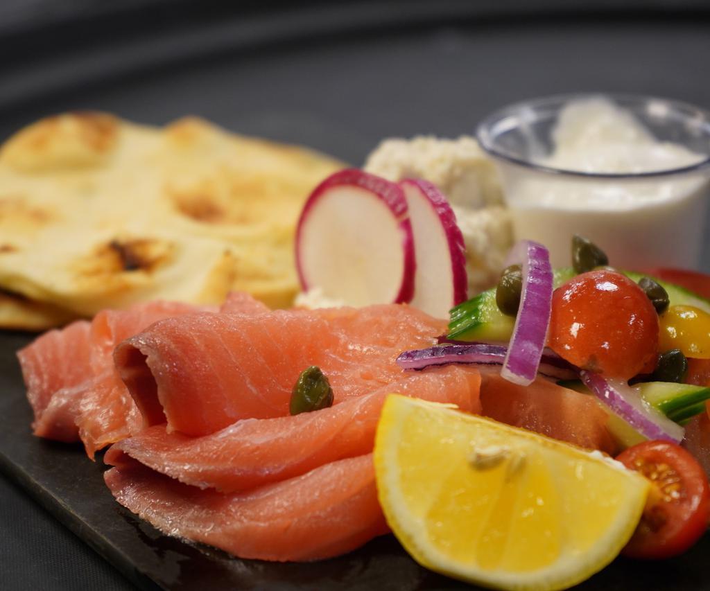 Ivy City Smokehouse Fish Board · Locally smoked salmon, whitefish salad, capers, red onion, cucumber, plum tomato, 
horseradish cream, toasted naan