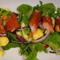 Smoked Honey Salmon Salad · Pieces of smoked Canadian Salmon, mixed greens, golden pineapple, cucumber, red onion, champ...