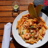 Shrimp Napolitano · Sauteed shrimp, penne pasta, pink cream sauce, melted mozzarella, garlic toast.