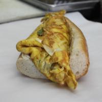 Ham & Cheese Omelet Sandwich · 4 Cage Free Extra Large Fresh Cracked Eggs to order with Grilled Honey Ham & your Choice of ...