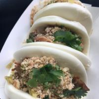 2 Piece Gua Bao · pork belly braised overnight in Chinese spice, wrapped in soft steamed bun, garnished with T...