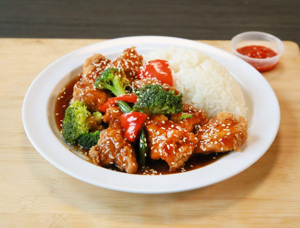 The Buddha · Chinese. Crispy chicken (breaded chicken breast) or grilled chicken with mixed veggies and covered with sweet and tangy sesame sauce,served over jasmine rice.