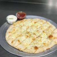 Cheesy Breadsticks · HUGE ORDER OF Baked pizza dough, topped with mozzarella, and garlic butter served with marin...