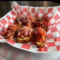 Bruschetta · Chopped tomato, fresh basil, and red onion mixed, with olive oil, Parmesan cheese served on ...