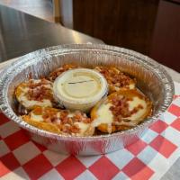 Giant Bacon and Cheese Potato Skins · Potato skins topped with bacon and mozzarella. Served with ranch.