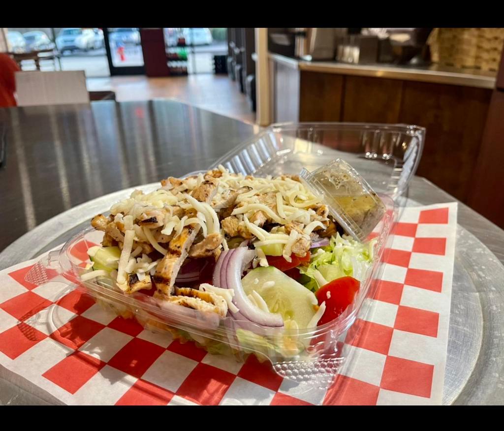 Grilled Chicken Salad · Iceberg, romaine, grilled chicken, Roma tomato, cucumber, and red onion.