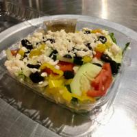 Greek Salad · Iceberg, romaine, Roma tomato, cucumber, red onion, black olive, and feta cheese.