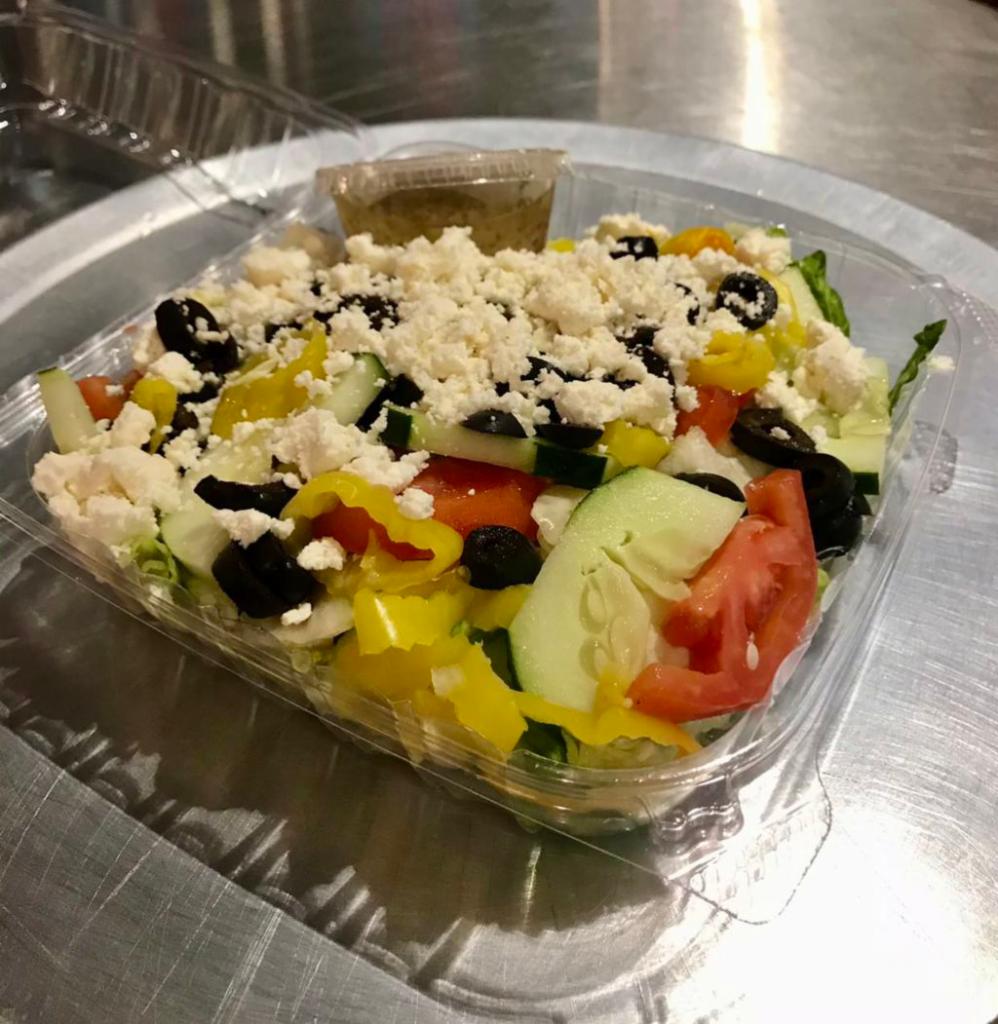 Greek Salad · Iceberg, romaine, Roma tomato, cucumber, red onion, black olive, and feta cheese.