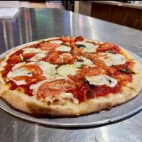 Margherita - An Italian Classic Pizza · Mozzarella, Roma tomato, fresh basil and extra virgin olive oil.