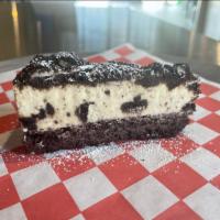 Oreo Mousse Cake · Rich and creamy chocolate mousse cake covered in oreos.