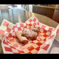 Fried Raspberry Cheesecake · 3 pieces of cheesecake rolled in dough and fried, sprinkled with powdered sugar.