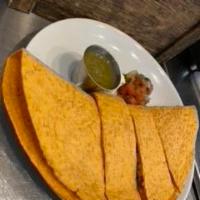 Vegetarian Breakfast Quesadilla · Tomato basil tortilla filled with organic scrambled eggs, pepper jack cheese, red and green ...