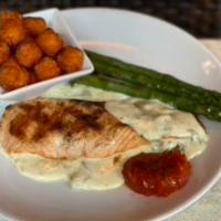 Anaheeim Salmon · Grilled wild caught Alaskan salmon, grilled asparagus, stweet potato tots and house made Ana...