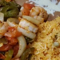 Camarones Tapatios · Jumbo shrimp grilled with jalapenos, onions and tomatoes. Served with rice, beans and flour ...