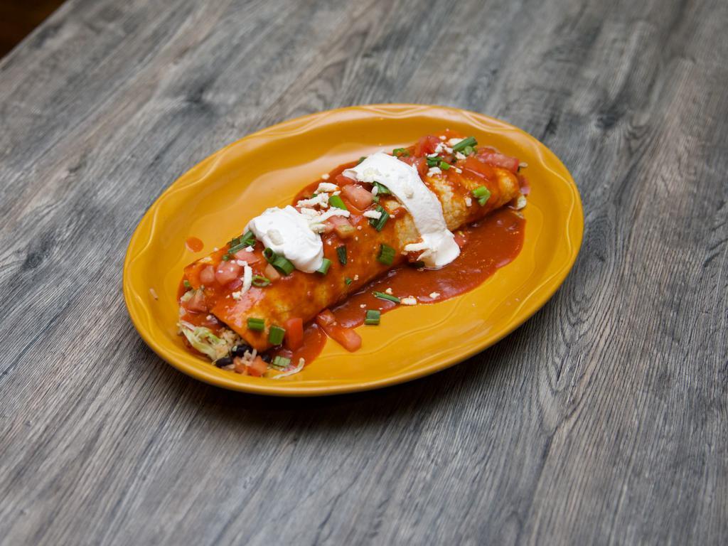 Expresso Burrito · Flour tortilla filled with black beans, rice, cheese, and lettuce and topped with sour cream, tomatoes, and green onions. Sprinkled with Cotija cheese and smothered with our special red enchilada sauce.