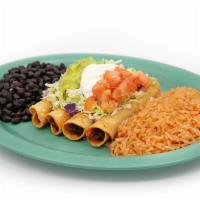 Chicken Taquitos Plate · 4 pieces. Shredded chicken in a corn tortilla, fried and topped with sour cream and guacamole.