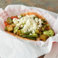 Grilled Veggie on Pita with Feta · Broccoli, carrots, snow peas, water chestnuts and crumble feta cheese