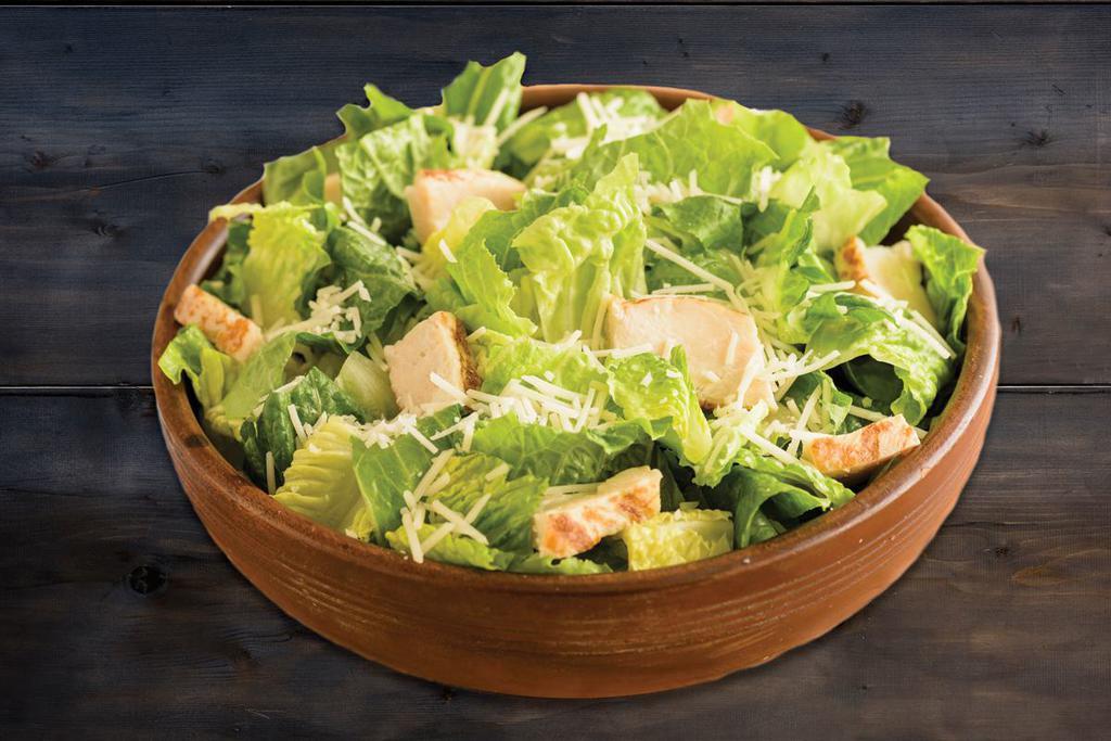 Chicken Caesar Salad · Romaine Lettuce topped with Grilled Chicken Breast Raised Without Antibiotics and Shredded Aged Parmesan Cheese.