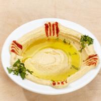 Hummus · Chickpeas, garlic, lemon juice and tahini (sesame sauce). Vegetarian and gluten free.