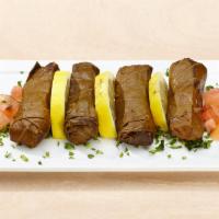 Grape Leaves · Tender vine leaves rolled and stuffed with rice and fresh herbs. Vegetarian and gluten free.