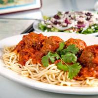 Meatballs With Spaghetti ·  Served with pitra bread and greek salad