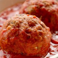 Homemade Meatballs · 2 large homemade meatballs rolled by hand and simmered in tomato sauce