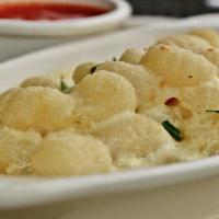 Gnocchi Quattro Formaggio · Potato dumplings simmered in creamy alfredo and baked with 4 italian cheeses served with a s...