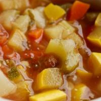 Cup of Minestrone · Classic italian vegetable soup (chicken broth with potatoes, celery, carrots, zucchini, and ...