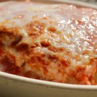 Baked Lasagna · Layers of Pasta, Beef, and Ricotta Cheese topped with Mozzarella and Baked to Perfection in ...