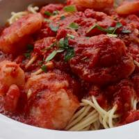 Shrimp Marinara · Jumbo shrimp sauteed in garlic and olive oil served over pasta with marinara sauce