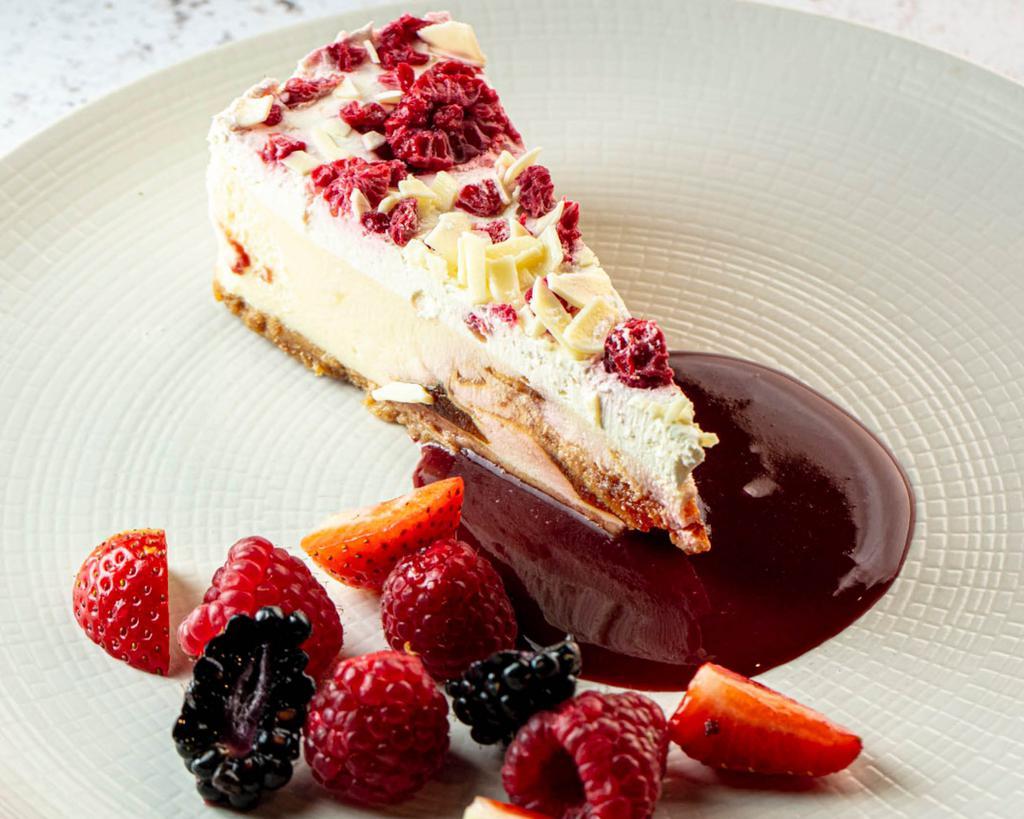 Cheesecake · Traditional cheesecake served with berries & raspberry coulis.